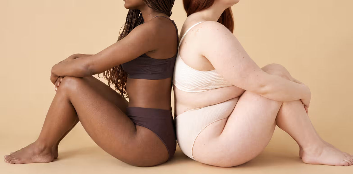 Two women with different body types and skin tones wearing neutral-toned activewear